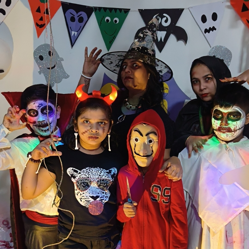 Kids gleefully parade in their spooky costumes at the Halloween party.