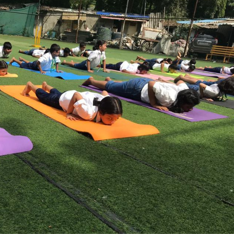 As the session ends, they feel rejuvenated and grateful for the opportunity to practice yoga at school.